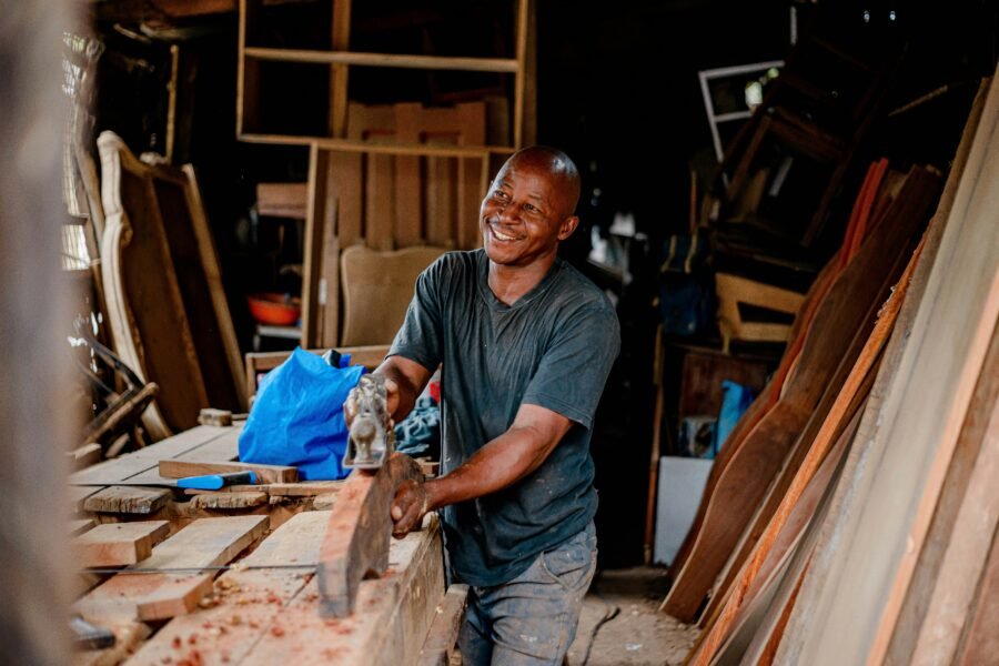 Smiling carpenter working in a workshop