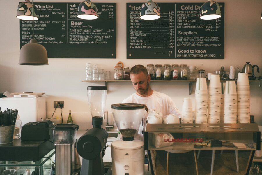 Barista working behind the counter of a coffee shop